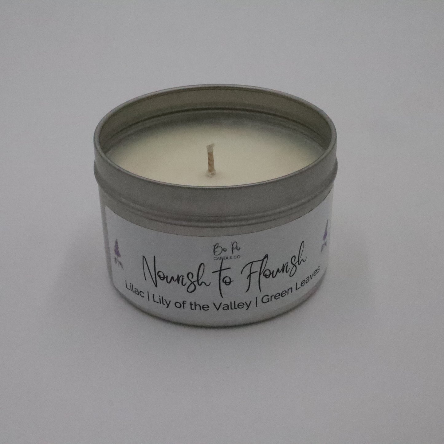 Nourish to Flourish Tin Candle | Lilac, Lily of the Valley, & Green Leaves | 6oz